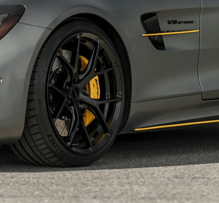 Brake caliper and disc behind an alloy wheel
